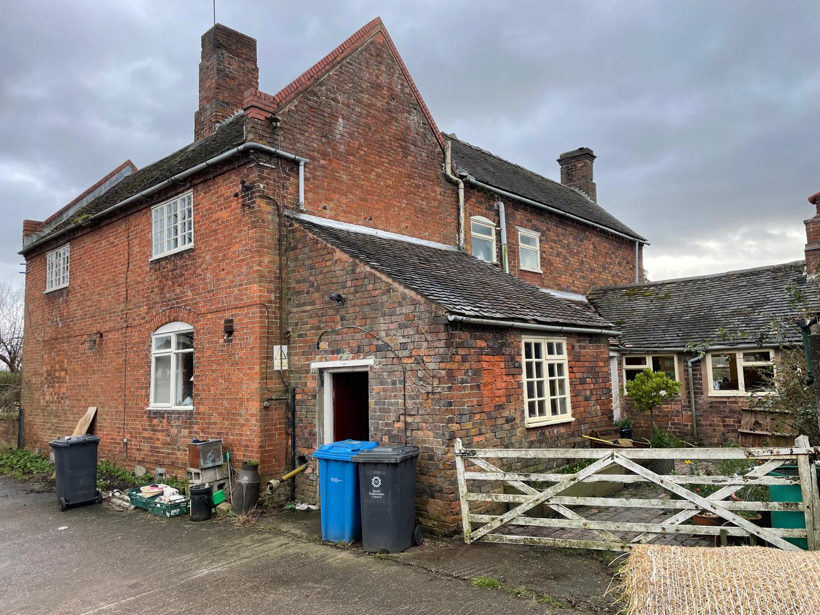 Red-brick farmhouse rear elevation and outbuildings before full renovation, Penkridge