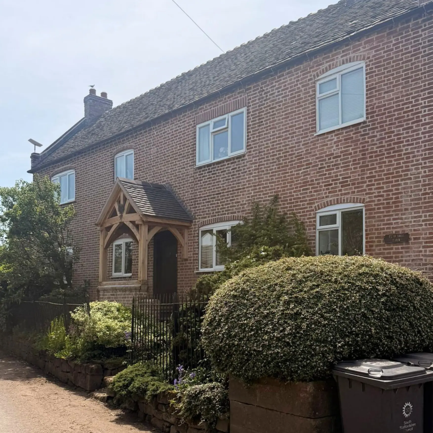 Repointed brick farmhouse with new oak-framed entrance porch, Pear Tree Farm, Lapley